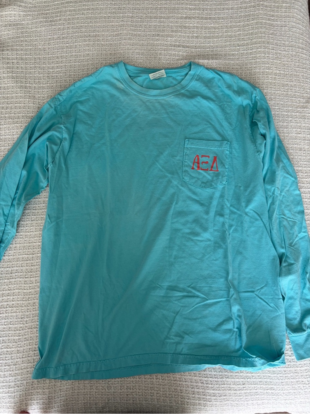 Turquoise Long-Sleeve Pocket Tee with Red Alpha Xi Delta Chest Logo